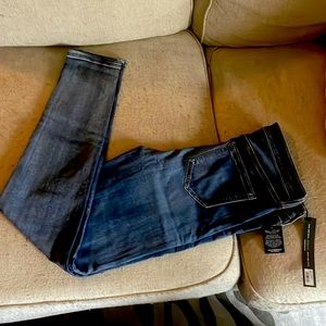 Dark wash skinny jeans. With tags